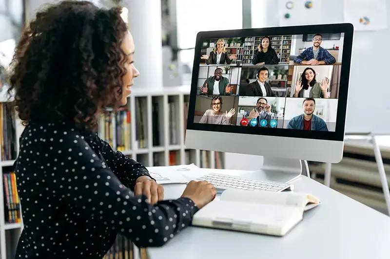 Smiling solopreneur on a Zoom call